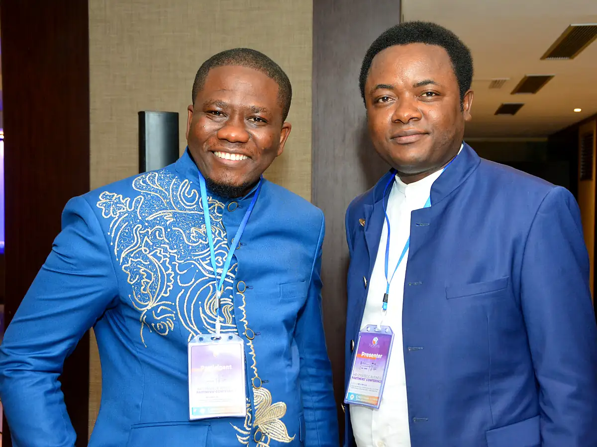 Two professionals at a Paraklete Institute event